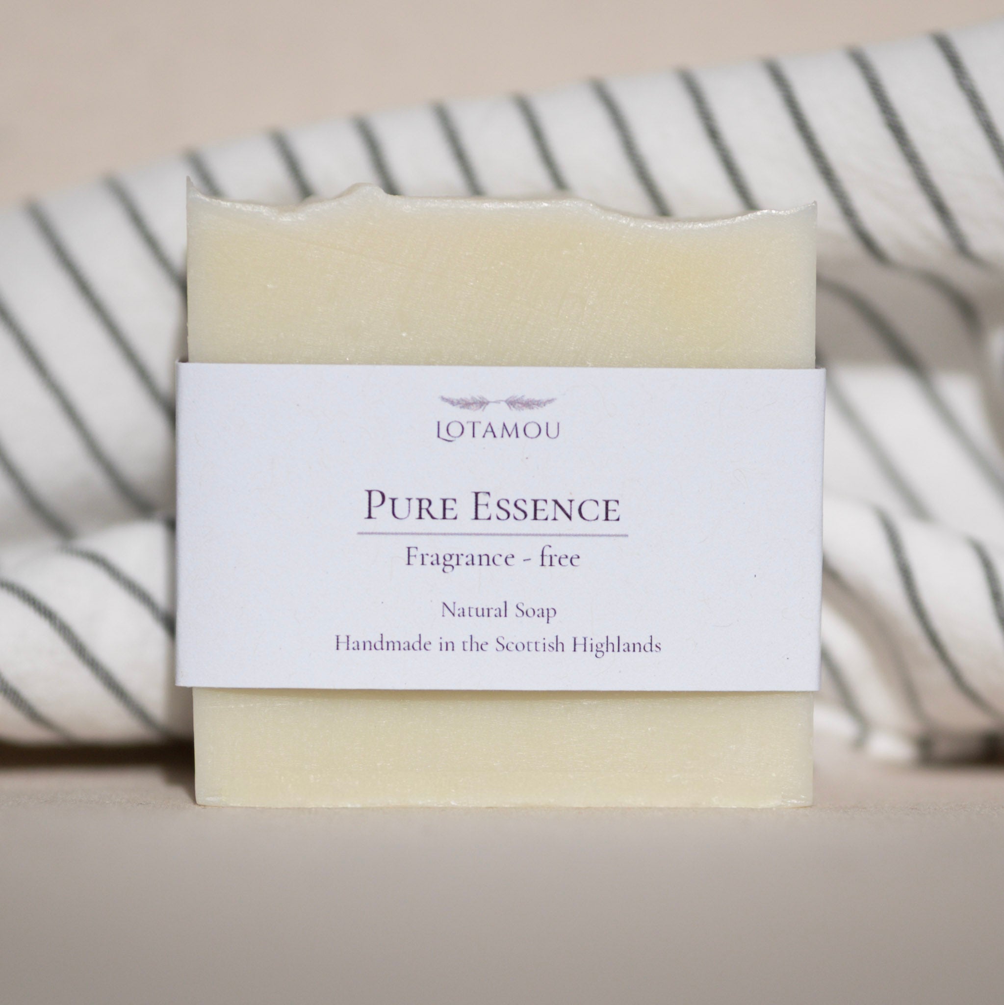 Bar of soap with a white label on a neutral background