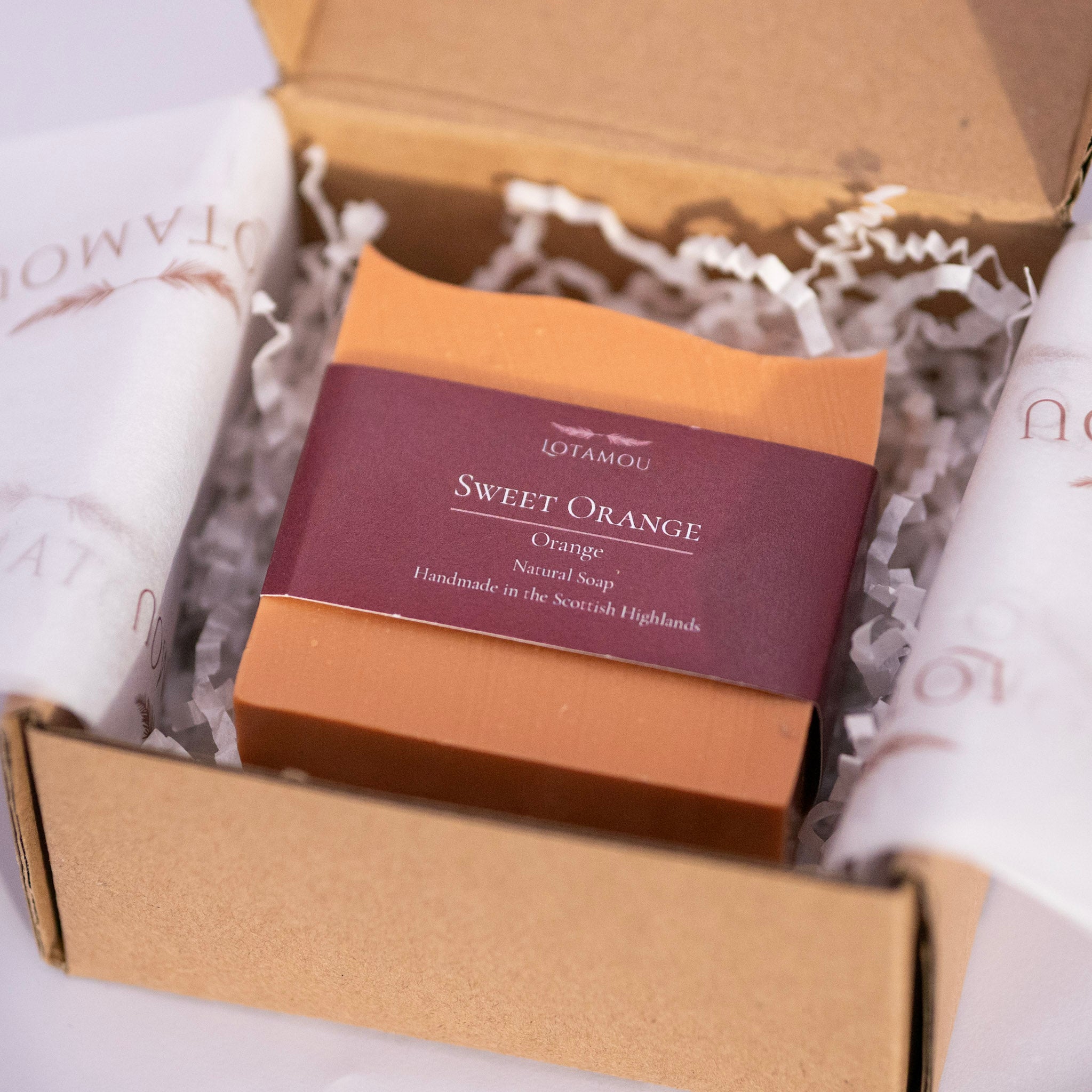 Box of Lotamou Sweet Orange soap with a purple label on a white background