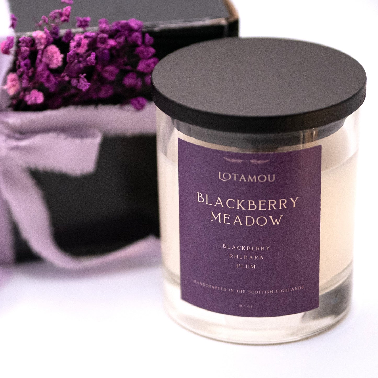 Blackberry Meadow scented candle, crafted with a refreshing medley of fruits. This fragrance oil is perfect for creating a bright and happy atmosphere, reminiscent of a summer's day spent picking fruit in the countryside.