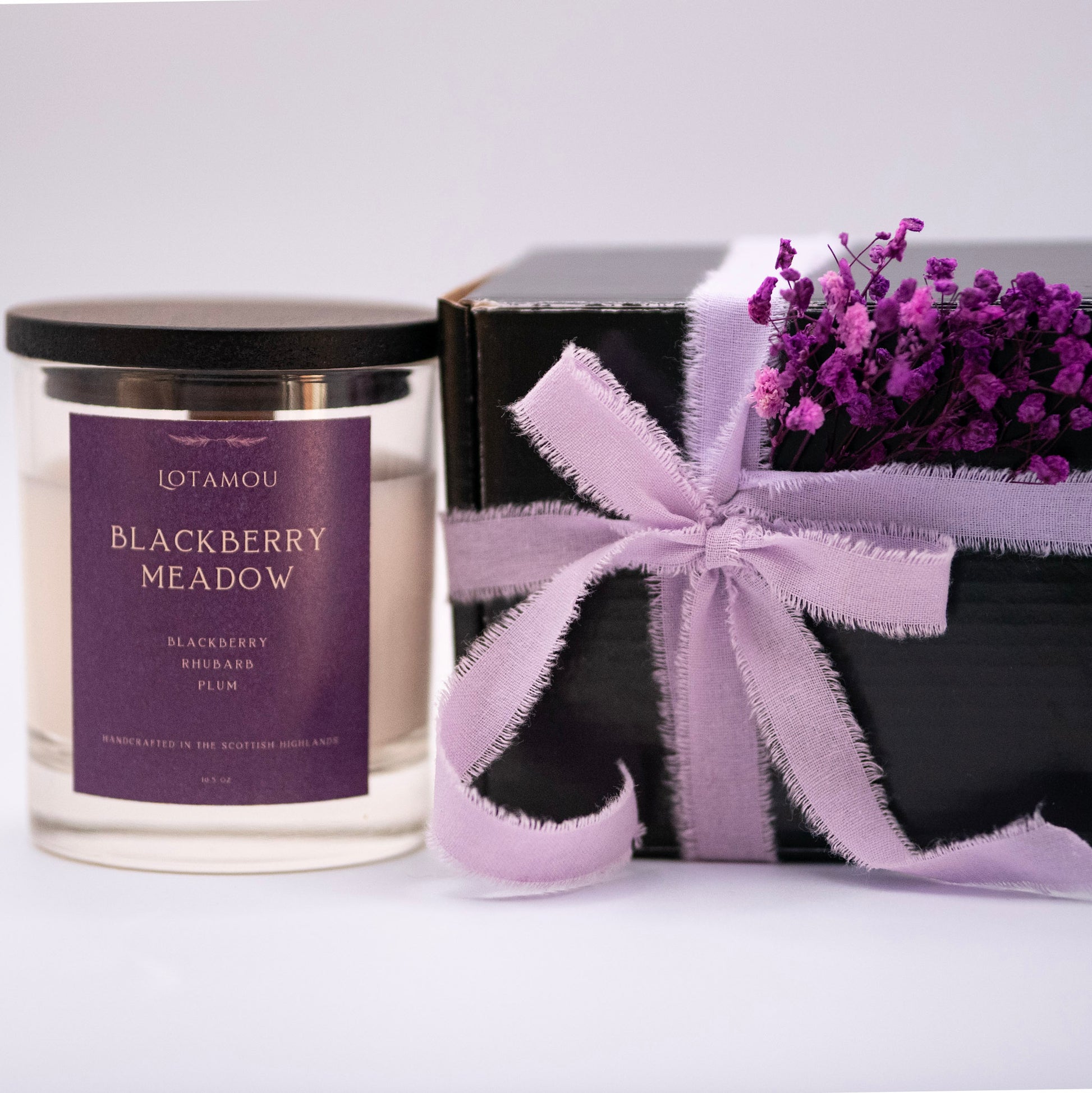 Blackberry Meadow scented candle, crafted with a refreshing medley of fruits. This fragrance oil is perfect for creating a bright and happy atmosphere, reminiscent of a summer's day spent picking fruit in the countryside.