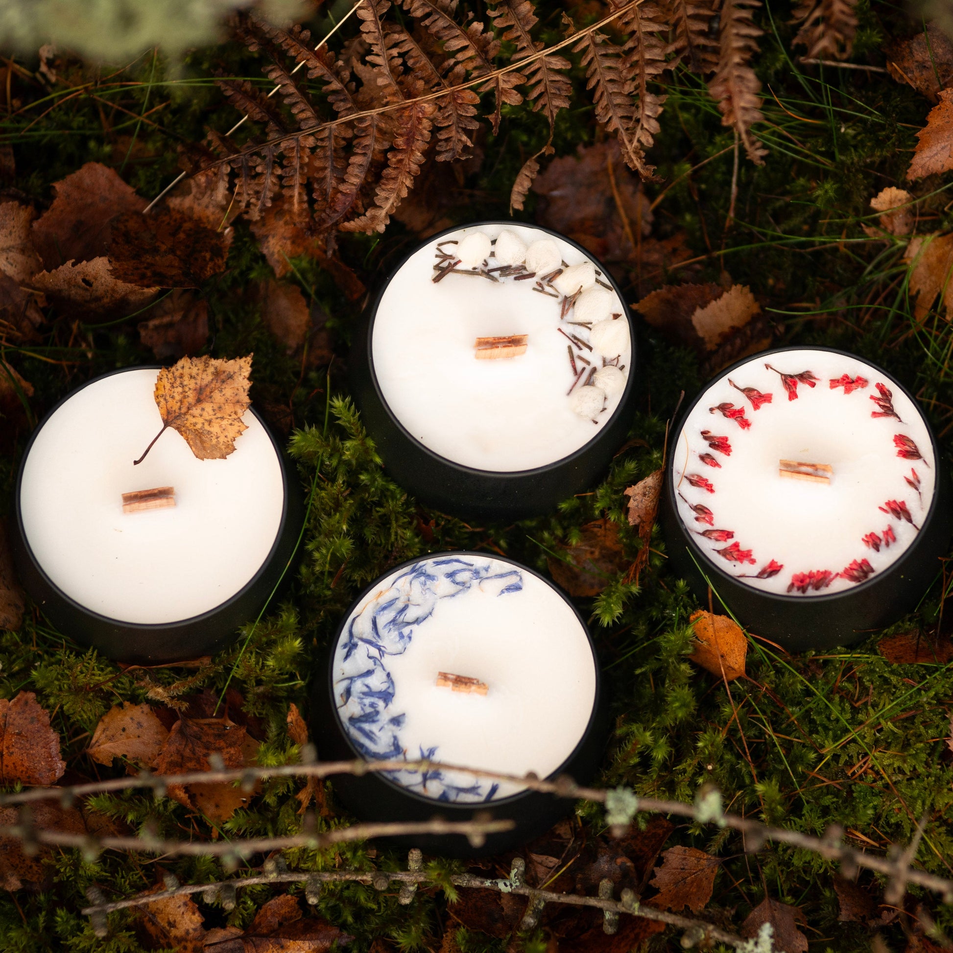 Four scented candles in a matte black tins with lids. Soy wax candles with wooden wicks. Hand-poured in the heart of the Scottish Highlands.