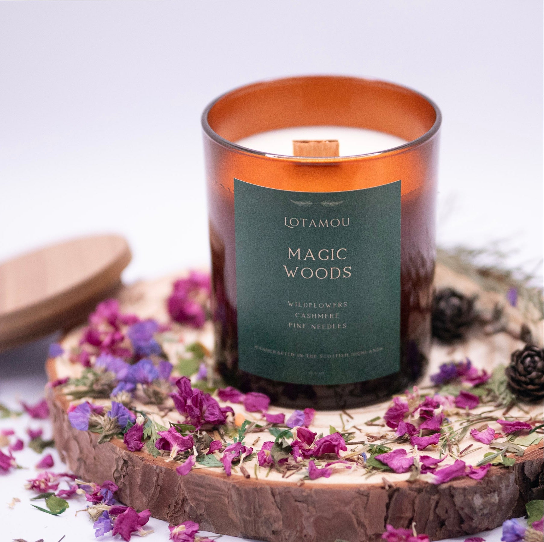 The Magic Woods scented candle, infused with the fragrance of Enchanted Forest. 100% natural soy candle with wooden wick and silicone-free lid.